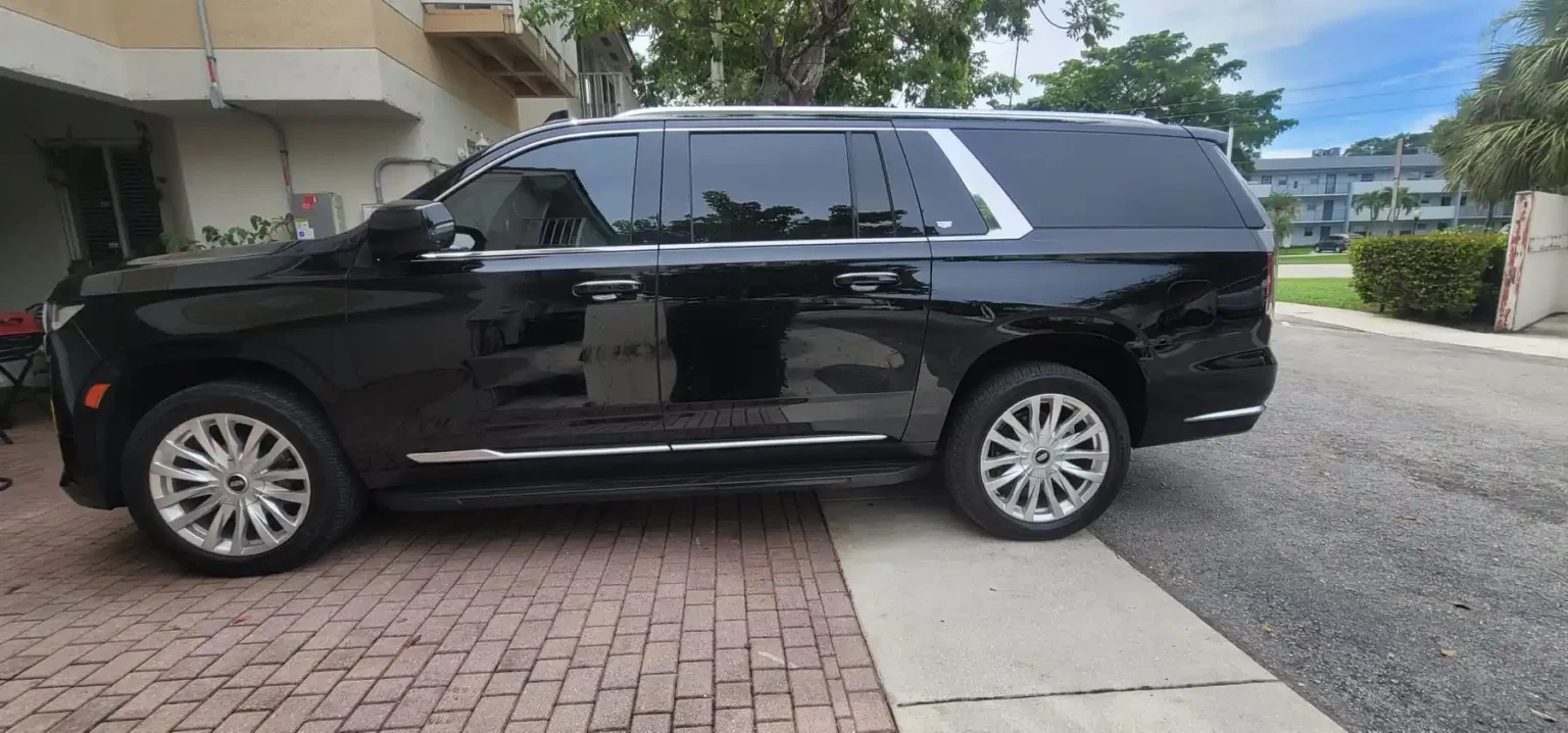Black luxury SUV from Soflo Limo Service, side profile