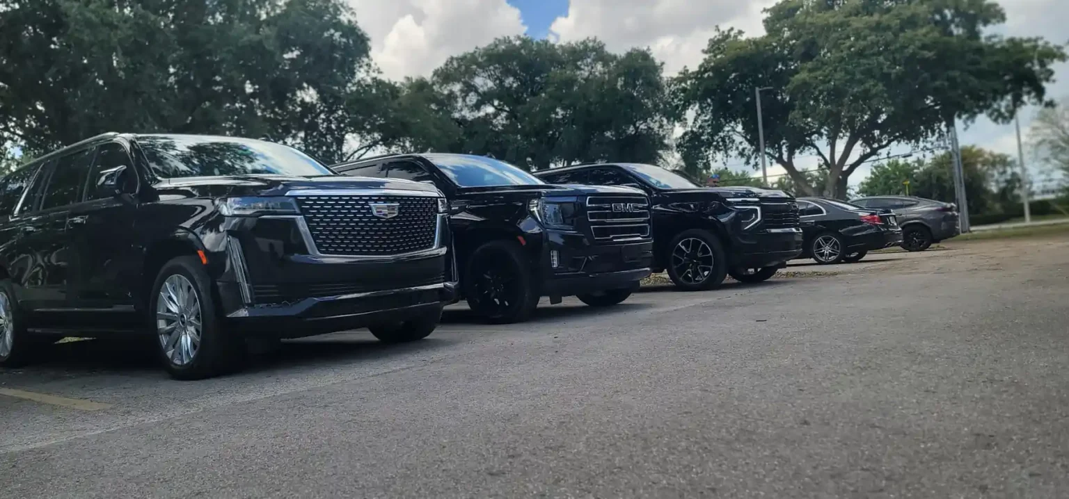 Black chauffeur SUVs lined up and ready for pickups