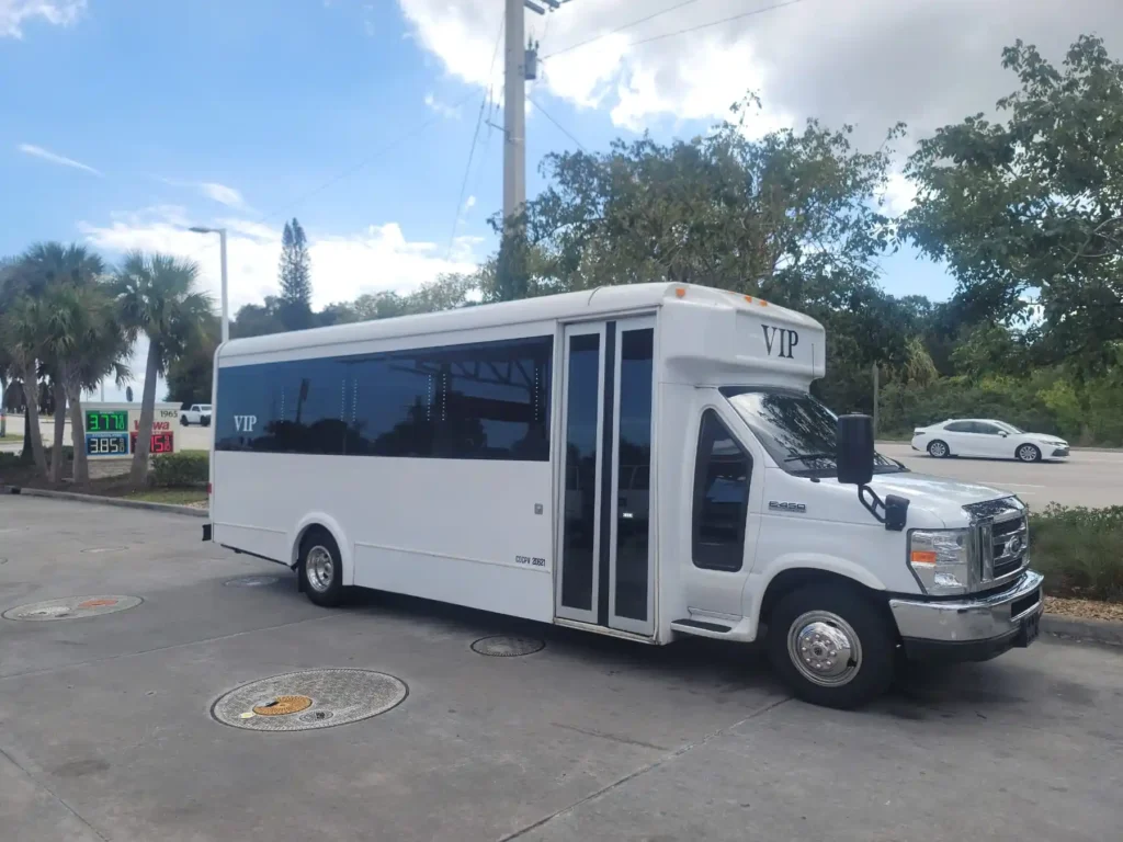 White VIP shuttle bus with passenger door open
